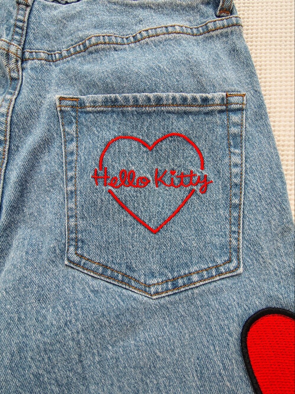 Hello Kitty Light Blue High-Rise Jeans with Red Bow Appliqués - Picture 3 of 15